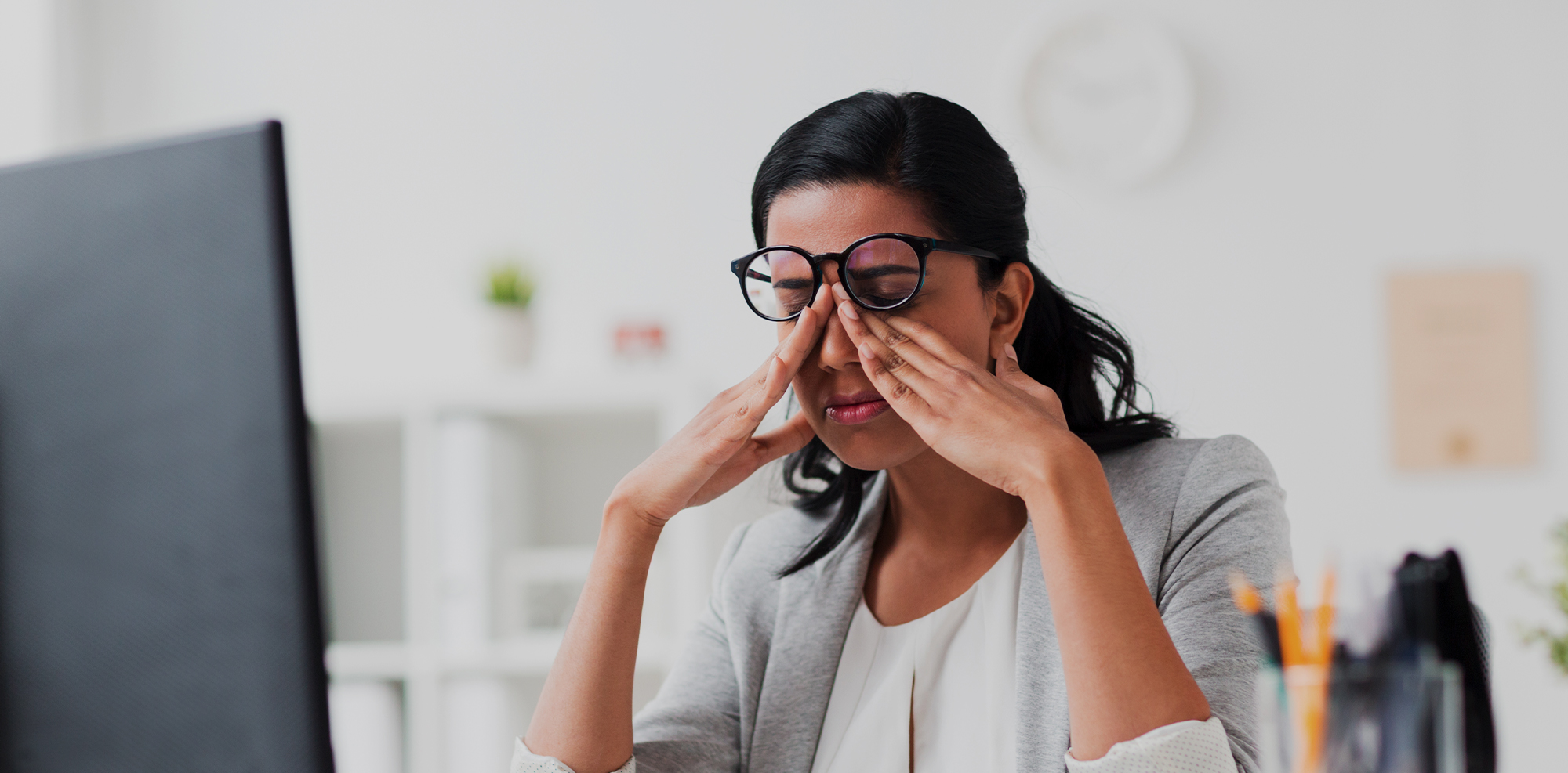 Womans eyes suffereing from too much screen time