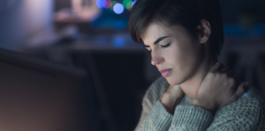 Woman with headache from too much screen time