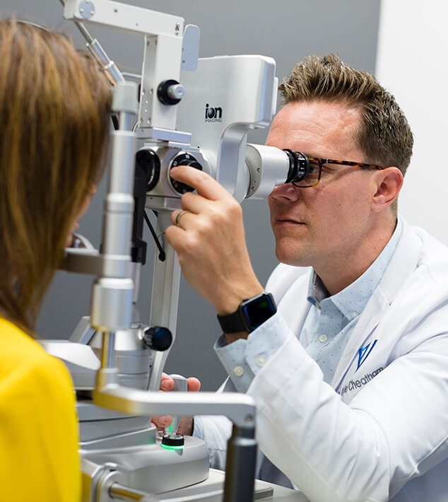 Eye doctor at Vision Specialists doing an eye exam