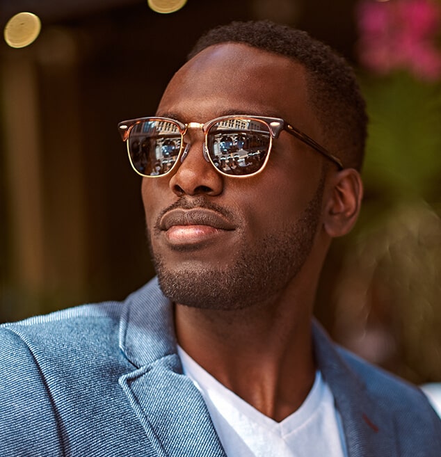 Man wearing designer sunglasses from Vision Specialists
