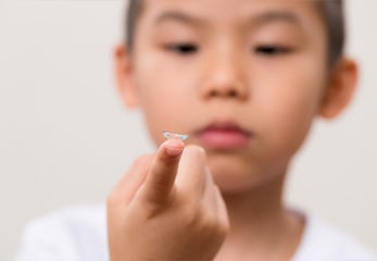 Boy holding misight daytime soft lenses