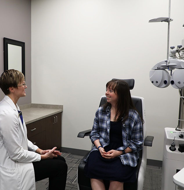 Woman talking to eye doctor at Vision Specialists