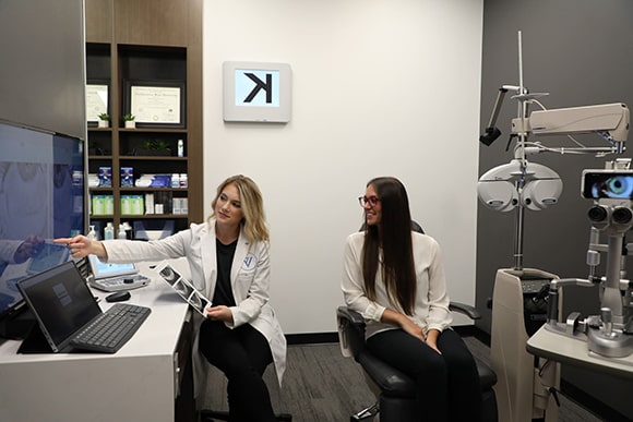 Eye doctor going over eye exam results at Vision Specialists in Omaha